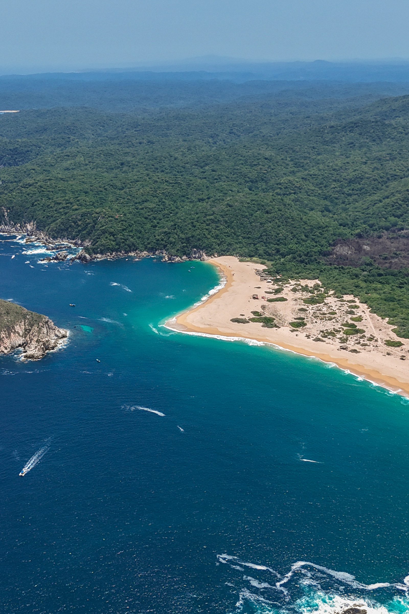 Aerial view of a bay and its beach in Huatulco