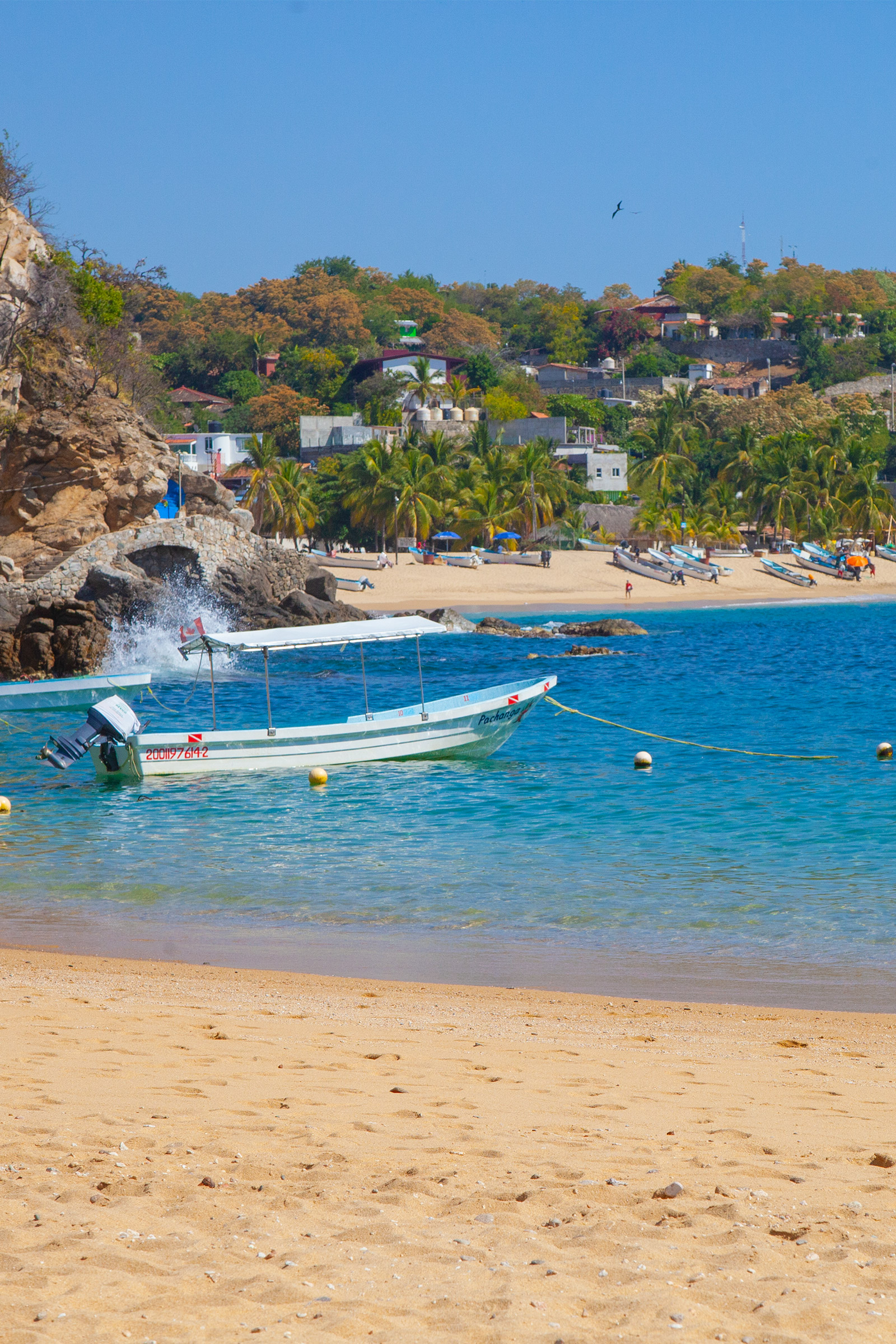 Boat and beach in Puerto Ángel